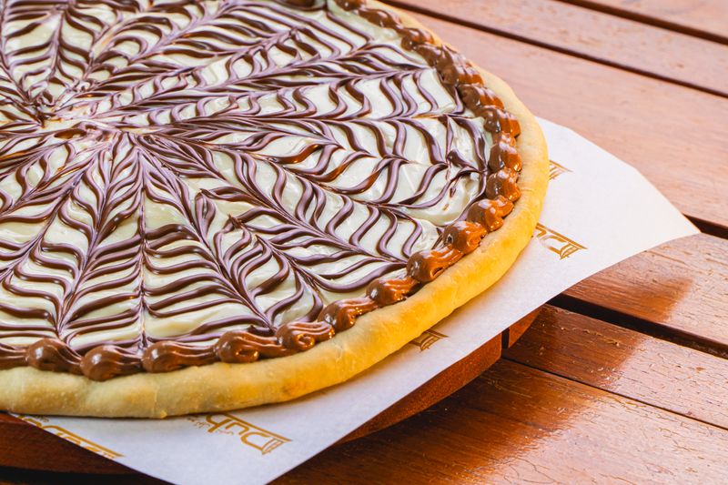 Cinnamon sugar dessert pizza with cream cheese icing